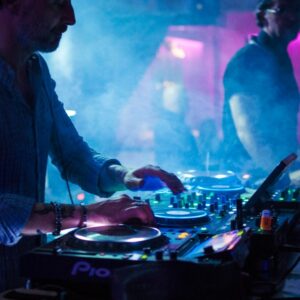 Male DJ performing a live trick on the turntables at a Dubai nightclub